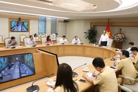 Bộ trưởng, Chủ nhiệm Văn phòng Chính phủ Mai Tiến Dũng chủ trì buổi làm việc. (Ảnh: Văn Điệp/TTXVN)