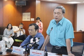Ông Trần Quang Bá, Quyền Chủ tịch UBND Quận 3 thông tin về vụ việc. (Ảnh: Xuân Anh/TTXVN)