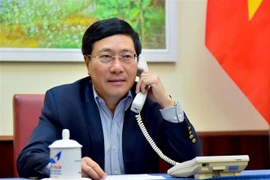 Phó Thủ tướng, Bộ trưởng Ngoại giao Phạm Bình Minh điện đàm với Bộ trưởng Ngoại giao Australia Marise Payne. (Nguồn: TTXVN)