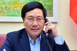 Phó Thủ tướng, Bộ trưởng Bộ Ngoại giao Phạm Bình Minh điện đàm với Bộ trưởng Ngoại giao, Liên minh châu Âu và Hợp tác Tây Ban Nha Arancha Gonzalez Laya. (Ảnh: TTXVN)