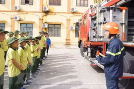 Hướng dẫn các kỹ năng phòng chống cháy nổ cơ bản cho các em nhỏ. (Ảnh minh họa. Nguồn: TTXVN)