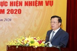 Bộ trưởng Bộ Tài chính Đinh Tiến Dũng phát biểu. (Ảnh: Phạm Hậu/TTXVN)