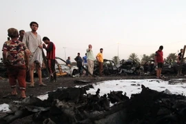 Hiện trường một vụ đánh bom ở Sadr ngày 15/8. (Nguồn: AFP/TTXVN)