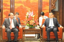 Phó Thủ tướng Nguyễn Xuân Phúc hội kiến Thủ tướng nước Cộng hòa Nhân dân Trung Hoa Lý Khắc Cường. (Ảnh: TTXVN)