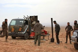 Binh sỹ Syria tại làng Jihar sau chiến dịch truy quét ngày 8/3. (Nguồn: AFP/TTXVN)