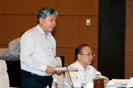 Bộ trưởng Bộ Tư pháp Hà Hùng Cường phát biểu ý kiến. (Ảnh: Phạm Kiên/TTXVN)
