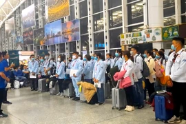 Lao động Việt Nam chuẩn bị đi làm việc ở nước ngoài. (Ảnh: Vietnam+)