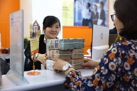 Nhiều ngân hàng đạt lợi nhuận trước thuế ở mức cao. (Ảnh: TTXVN)