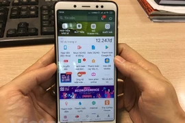 Mobile Money đã đáp ứng nhu cầu thiết thực của người dân. (Ảnh: Vietnam+)