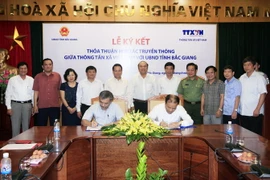 Quang cảnh lễ ký thỏa thuận. (Ảnh: Đức Tám/TTXVN)