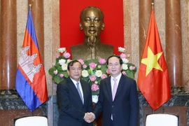 Chủ tịch nước Trần Đại Quang tiếp ông Prak Sokhon, Bộ trưởng Ngoại giao và Hợp tác Quốc tế Campuchia nhân chuyến thăm chính thức Việt Nam. (Ảnh: Nhan Sáng/TTXVN)