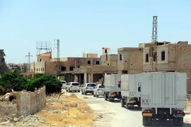 Đoàn xe chở hàng cứu trợ tới Daraya, Syria ngày 1/6. (Nguồn: THX/TTXVN)