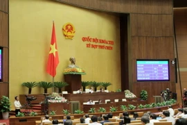 Quốc hội biểu quyết thông qua Nghị quyết về Chương trình hoạt động giám sát của Quốc hội năm 2016. (Ảnh: Phương Hoa/TTXVN)