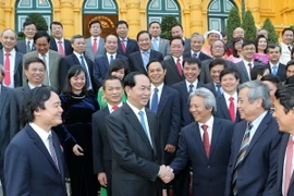 Chủ tịch nước Trần Đại Quang với các đại biểu tại buổi gặp mặt. (Ảnh: Nhan Sáng/TTXVN)