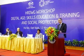 Thứ trưởng Bộ Lao động-Thương binh và Xã hội Doãn Mậu Diệp phát biểu tại hội thảo. (Ảnh: An Đăng/TTXVN)