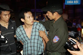 Một đối tượng bị cảnh sát cơ động 141 bắt giữ. (Ảnh: Doãn Tấn/TTXVN)