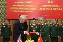 Quang cảnh Lễ ký Bản Ghi nhớ về hợp tác trong lĩnh vực quốc phòng giữa Bộ Quốc phòng hai nước. (Nguồn: TTXVN)