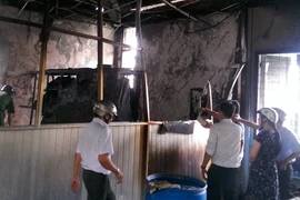 Hiện trường vụ cháy Trường trung học cơ sở Trần Quốc Tuấn. (Ảnh: Mạnh Linh/TTXVN)