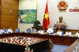 Thủ tướng Nguyễn Xuân Phúc, Chủ tịch Ủy ban Quốc gia về biến đổi khí hậu chủ trì cuộc họp lần thứ 8 về biến đổi khí hậu. (Ảnh: Thống Nhất/TTXVN)