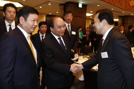 Thủ tướng Nguyễn Xuân Phúc với các đại biểu. (Ảnh: Thống Nhất/TTXVN)