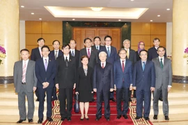 Tổng Bí thư Nguyễn Phú Trọng và các đại biểu chụp ảnh chung. (Ảnh:Trí Dũng/TTXVN)