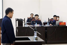 Đại diện Viện Kiểm sát tham gia phần xét hỏi bị cáo Hồ Hữu Hòa. (Ảnh: Phạm Kiên/TTXVN)