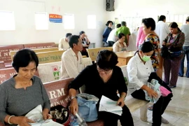 Bệnh nhân đến khám, chữa bệnh Bảo hiểm y tế. (Ảnh: Kim Há/TTXVN)