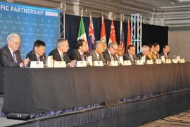 Bộ trưởng Thương mại các nước tham gia đàm phán TPP họp báo chung thông báo hoàn tất quá trình đàm phán hiệp định thương mại lịch sử TPP. (Ảnh: Thanh Tuấn/TTXVN)