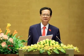 Thủ tướng Nguyễn Tấn Dũng trình bày báo cáo trước Quốc hội. (Ảnh: Doãn Tấn/TTXVN)