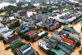 Mưa lũ đã khiến nhiều tuyến đường và hàng nghìn ngôi nhà ở thành phố Hà Giang bị ngập chìm trong nước. (Ảnh: TTXVN phát)