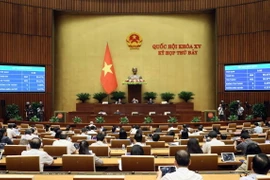 Quốc hội biểu quyết thông qua Luật sửa đổi, bổ sung một số điều của Luật Cảnh vệ. (Ảnh: An Đăng/TTXVN)