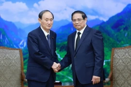 Thủ tướng Phạm Minh Chính tiếp cựu Thủ tướng Nhật Bản Suga Yoshihide sang dự Lễ Quốc tang Tổng Bí thư Nguyễn Phú Trọng. (Ảnh: Dương Giang/TTXVN)