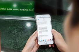 Đăng ký online mua vàng miếng SJC tại Vietcombank. (Ảnh: TTXVN phát)