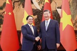 Thủ tướng Phạm Minh Chính hội kiến Tổng Bí thư, Chủ tịch Trung Quốc Tập Cận Bình. (Ảnh: Dương Giang/TTXVN)