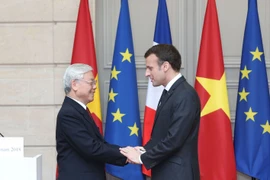 Tổng Bí thư Nguyễn Phú Trọng và Tổng thống Cộng hòa Pháp Emmanuel Macron trong chuyến thăm chính thức của Tổng Bí thư đến Cộng hòa Pháp năm 2018. (Ảnh: Trí Dũng/TTXVN)