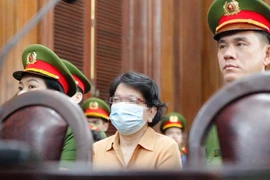 Bị cáo Đỗ Thị Nhàn, cựu Cục trưởng Cục Thanh tra, Giám sát Ngân hàng II (Cục II) thuộc Ngân hàng Nhà nước tại phiên tòa ngày 27/3. (Ảnh: Thanh Vũ/TTXVN)