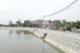 Một điểm đã được cưỡng chế giải tỏa vi phạm trật tự xây dựng trên đất nông nghiệp để xây dựng ao hồ cải tạo cảnh quan khu vực nông thông ở huyện Đông Anh. (Ảnh: Mạnh Khánh/TTXVN)