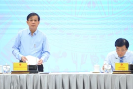 Thứ trưởng Bộ Lao động, Thương binh và Xã hội Nguyễn Bá Hoan trả lời báo chí tại buổi họp báo. (Ảnh: Minh Đức/TTXVN)