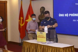 [Photo] TTXVN quyên góp ủng hộ phòng, chống dịch COVID-19
