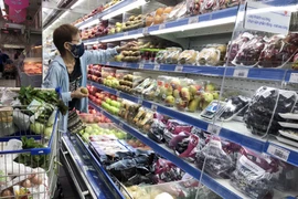 Giãn cách xã hội giúp nhiều gia đình có nhiều thời gian ở bên nhau trong các sinh hoạt hàng ngày. (Ảnh: Mỹ Phương/TTXVN.)