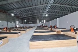 Khu điều trị bệnh nhân COVID-19 dã chiến tại xã Lai Hưng, huyện Bàu Bàng, tỉnh Bình Dương với quy mô 1.000 giường đang gấp rút hoàn thành. (Ảnh: TTXVN)