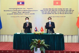 Bộ trưởng Ngoại giao Bùi Thanh Sơn và Bộ trưởng Ngoại giao Lào Saleumsay Kommasith đồng chủ trì Hội nghị. (Ảnh: TTXVN)