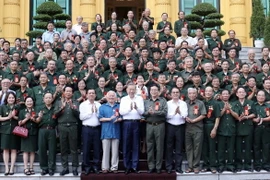 Chủ tịch nước Tô Lâm gặp mặt thân mật các đại biểu. (Ảnh: Nhan Sáng/TTXVN)