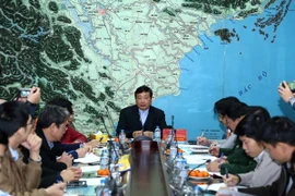 Tổng cục trưởng Tổng cục Phòng chống thiên tai, Ủy viên thường trực Ban chỉ đạo Trung ương về Phòng chống thiên tai Trần Quang Hoài báo cáo về diễn biến của cơn bão số 1. (Ảnh: Vũ Sinh/TTXVN)