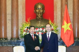 Chủ tịch nước Trần Đại Quang tiếp Chánh án Tòa án nhân dân tối cao Lào Kham Phanh Sit Thi Dam Pha đang có chuyến thăm và làm việc tại Việt Nam. (Ảnh: Nhan Sáng/TTXVN.)
