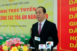 Chủ tịch nước Trần Đại Quang, Trưởng Ban Chỉ đạo cải cách Tư pháp Trung ương đến dự và phát biểu chỉ đạo Hội nghị tổng kết năm 2017 và triển khai công tác năm 2018 của ngành Tòa án. (Ảnh: Nhan Sáng/TTXVN)