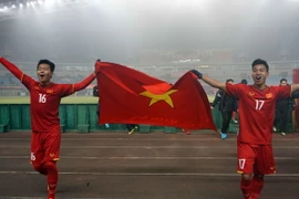 Niềm vui của các cầu thủ đội U23 Việt Nam khi giành quyền vào Bán kết U23 châu Á 2018. (Ảnh: Hoàng Linh/TTXVN)