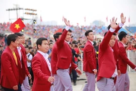 Các thành viên Đoàn thể thao Việt Nam dự chương trình Tự hào Việt Nam. (Ảnh: Trọng Đạt/TTXVN)