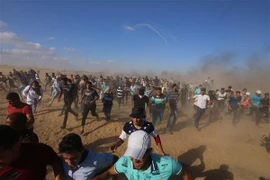 Xung đột giữa người biểu tình Palestine và quân đội Israel ở khu vực biên giới Dải Gaza-Israel. (Nguồn: THX/TTXVN)