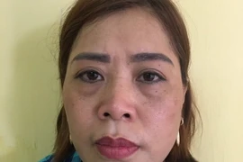 Đối tượng Nguyễn Thị Hồng tại cơ quan công an. (Nguồn: TTXVN)